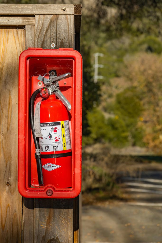 A fire extinguisher on a wall